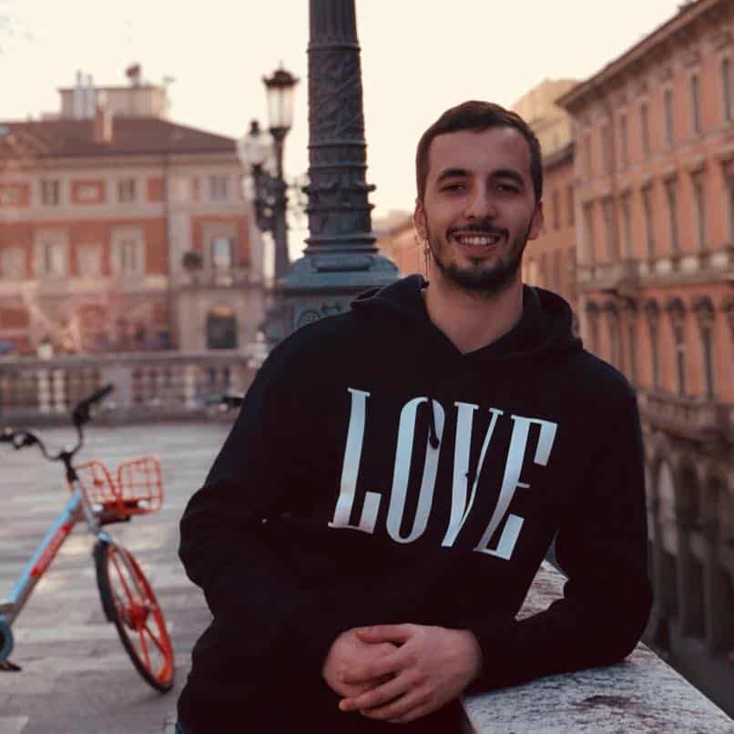 Jack slobodian leaning on a wall in Bologna