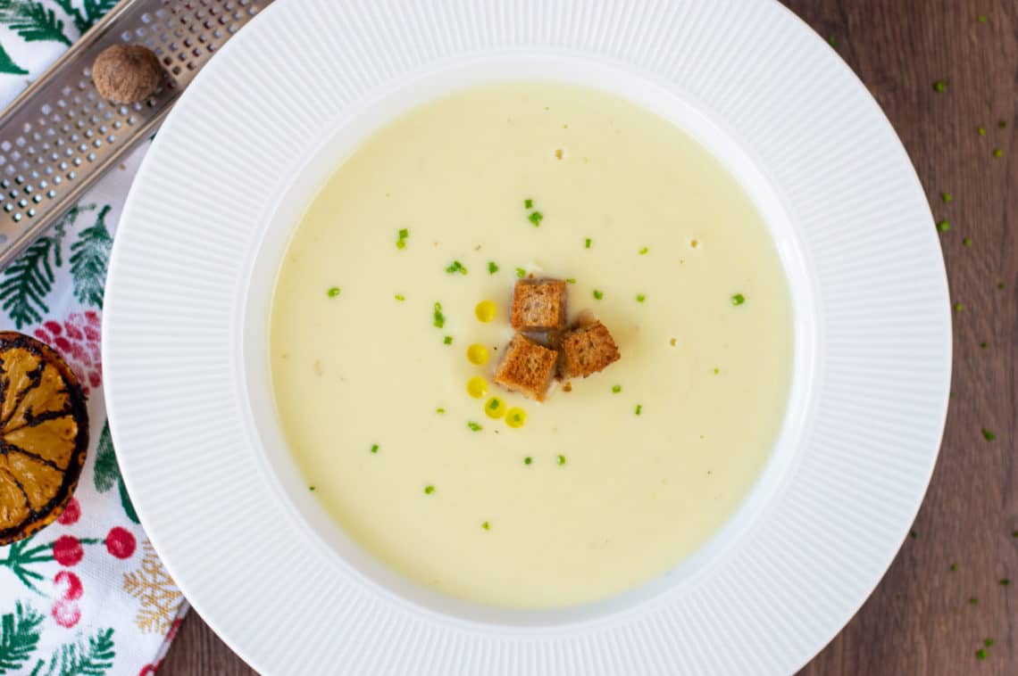 A top shot photo of my Cauliflower Soup recipes with a grilled lemon & nutmeg