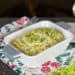 My Creamed Leeks recipe shot infant of a fireplace with a glass of white wine