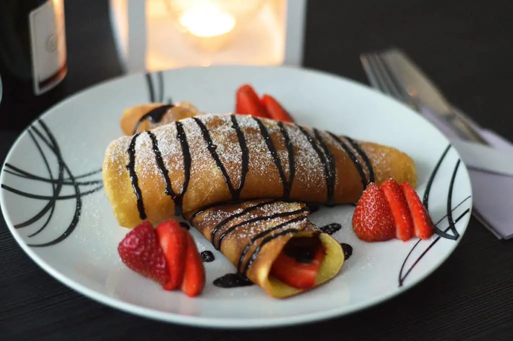 French Crepes with strawberries and chocolate sauce
