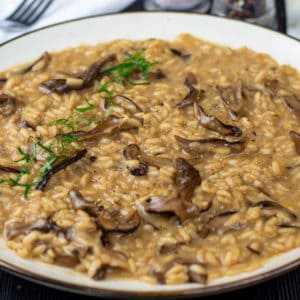 A photo of my Wild Mushroom Risotto recipe garnished with flat parsley