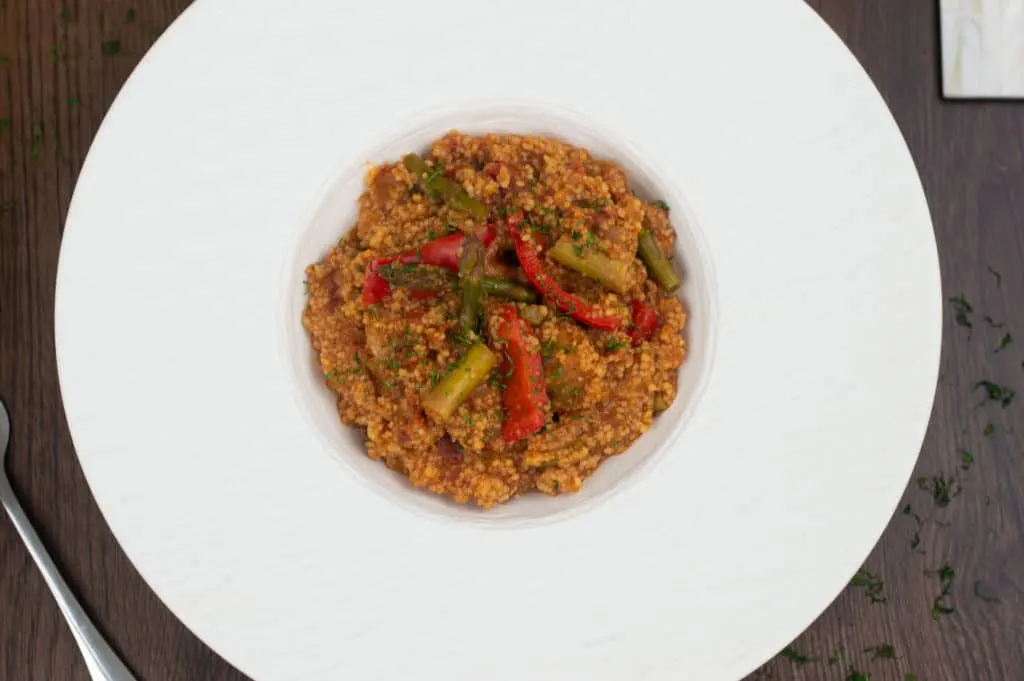 Moroccan couscous in a fancy white bowl