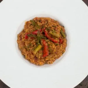 Moroccan couscous in a fancy white bowl