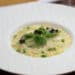 Truffle-Oil-Pasta topped with panko breadcrumbs and micro herbs served in a fancy white bowl