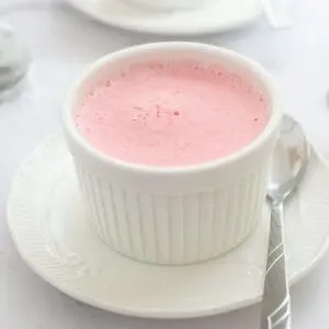 Frozen strawberry mousse in white ramekin