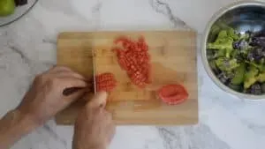 A photo of me dicing a tomato
