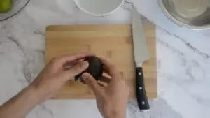 Twisting an avocado open