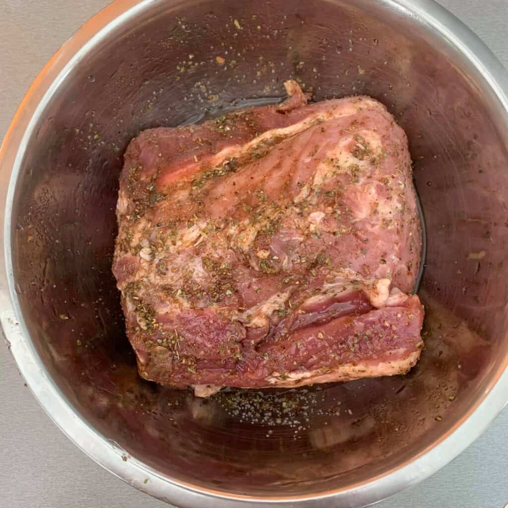 Marinading the pork in a bowl.