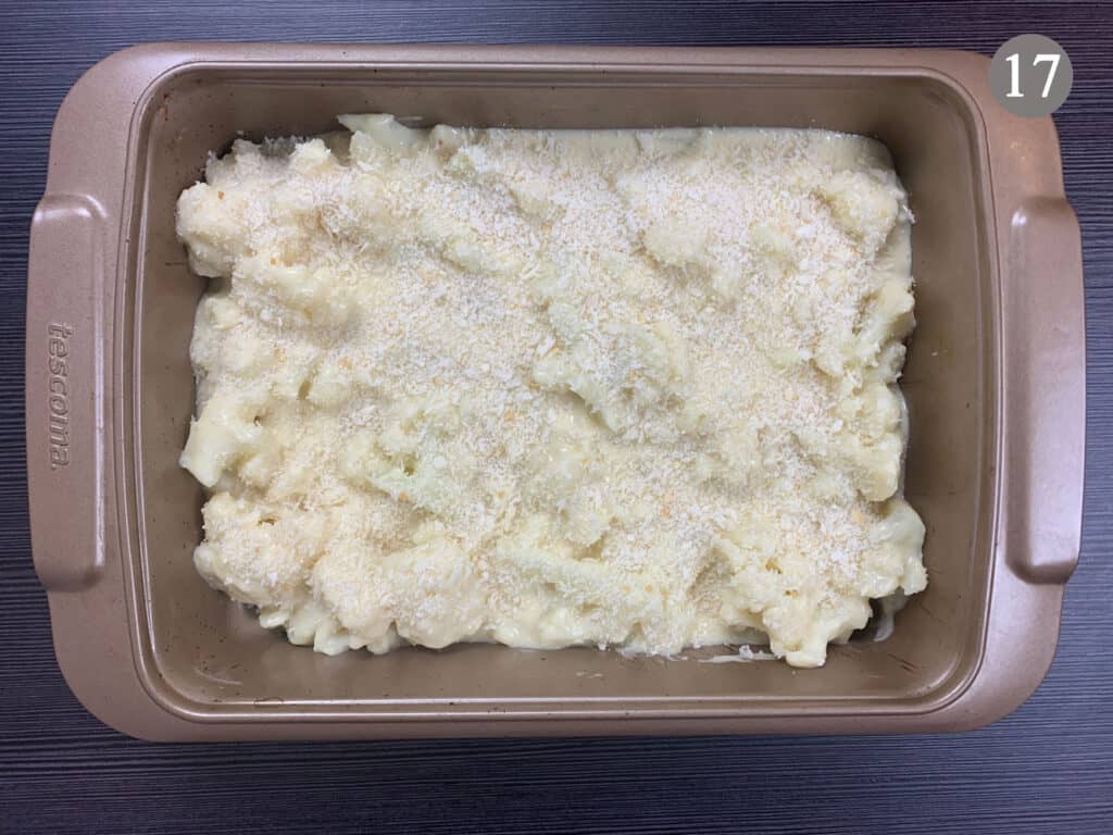 Cauliflower cheese in a baking tray with a large sprinkle of panko breadcrumbs