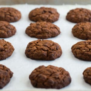 Baked vegan chocolate chip oatmeal cookies cooked on a baking tray