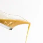 turkey gravy being poured out of a jug