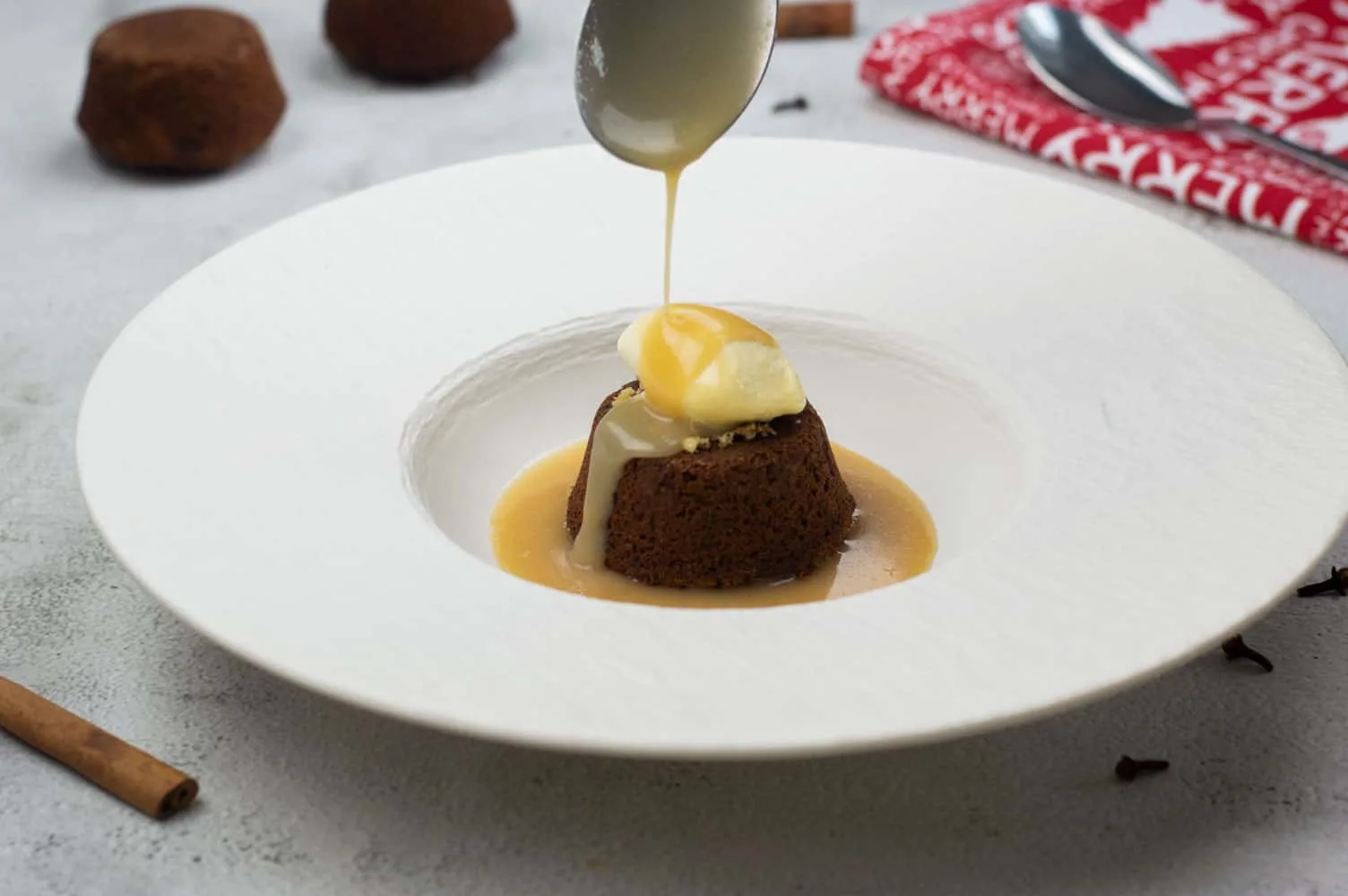 Sticky toffee pudding with spiced toffee sauce and ice cream