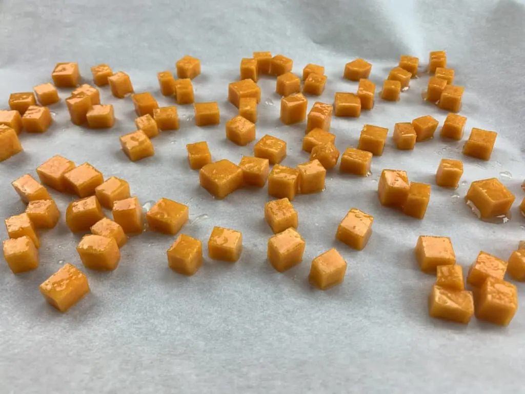 Diced butternut squash on a baking tray
