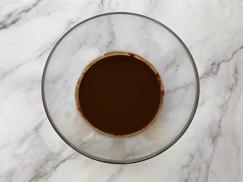 Melted chocolate in a glass bowl