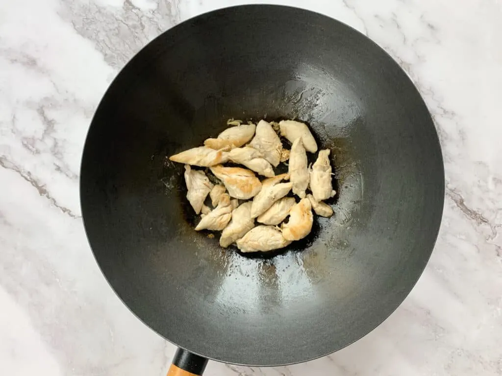 Cooked chicken in a large wok