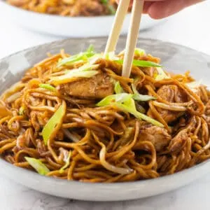 Chicken Chow Mein in a bowl with a pair of chop sticks