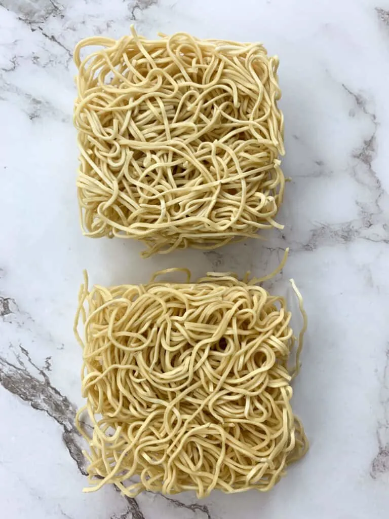 Two portions of dry wheat noodles