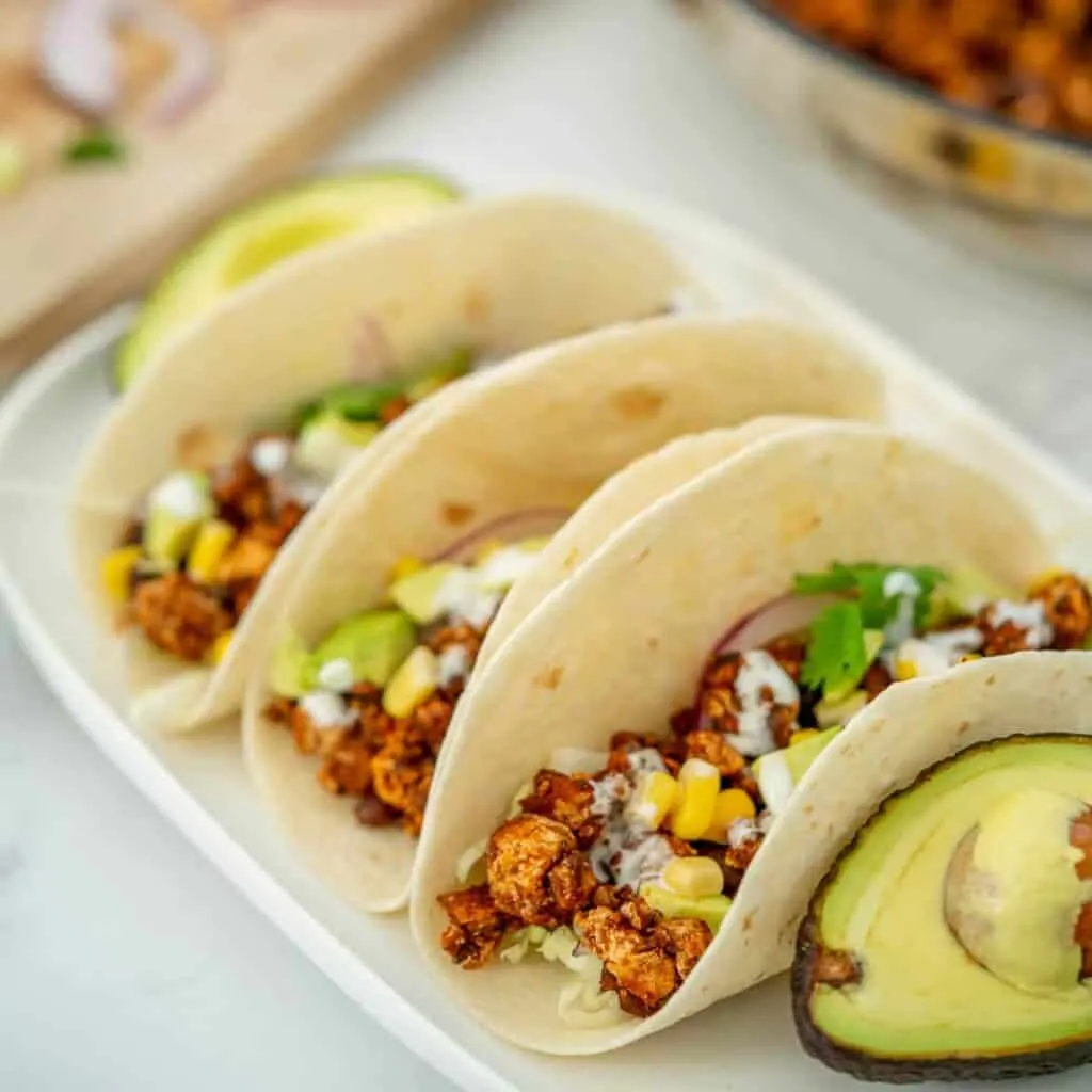 three tofu tacos with avocado