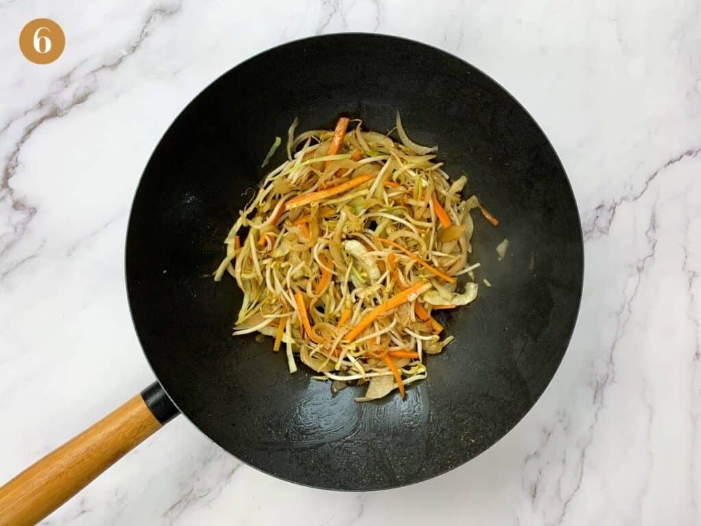 Stir fried vegetables in a black wok