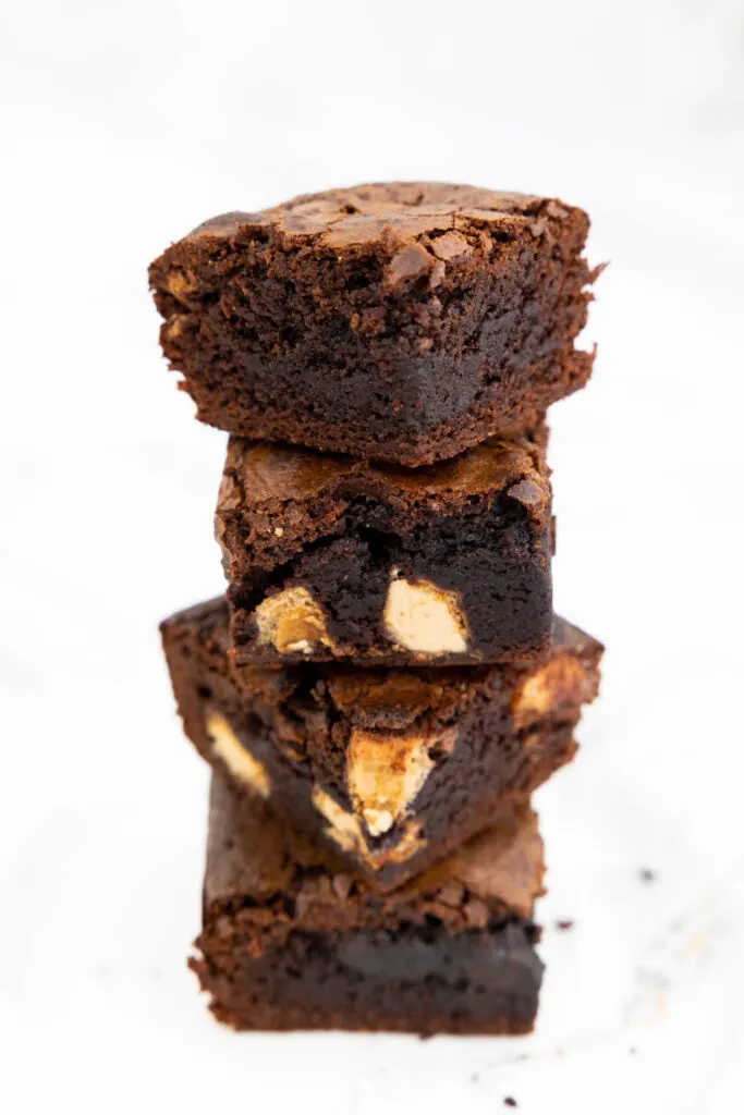 Four Kinder Bueno brownies stacked in a pile