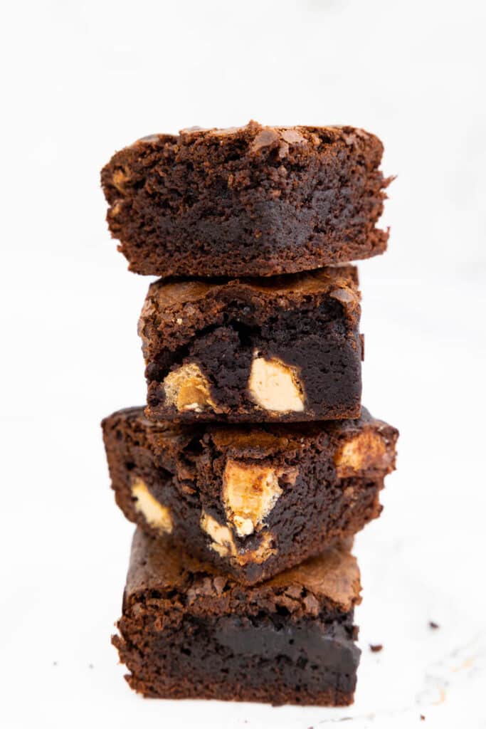 Four Kinder Bueno brownies stacked in a pile