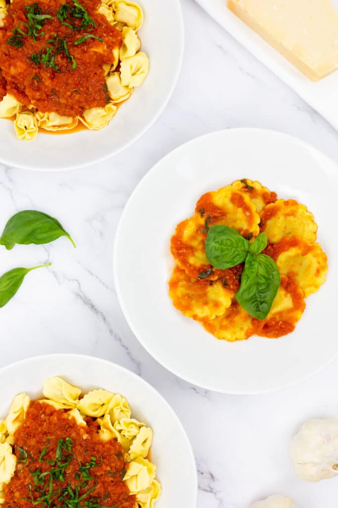 Fresh pasta dishes with San Marzano tomato sauce and basil