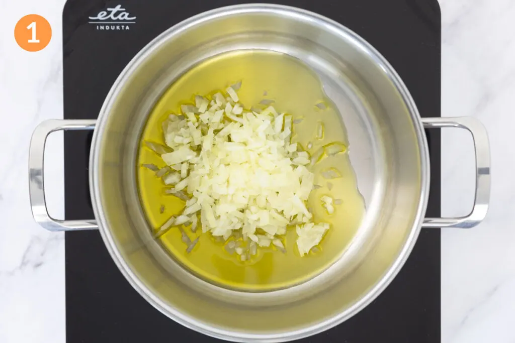 Onions and extra virgin olive oil in a large pot