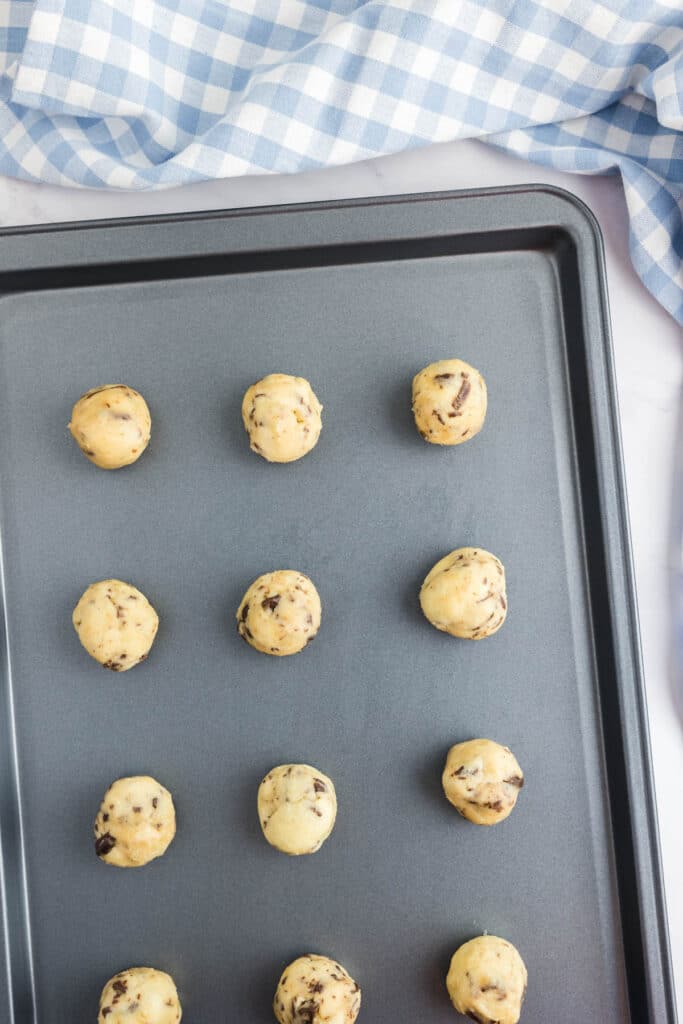 Cookie dough portioned on to a baking tray