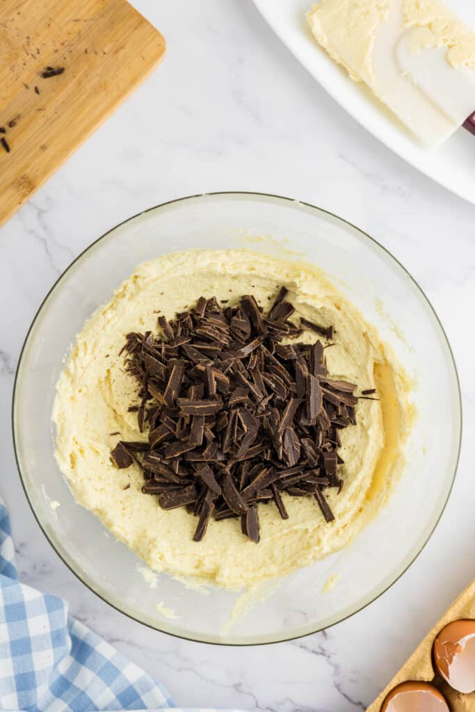 Chocolate added to the cookie dough in a large bowl