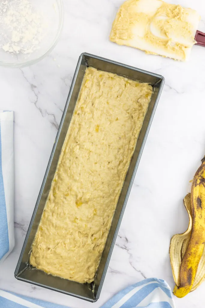 Dairy free banana bread batter in a loaf pan
