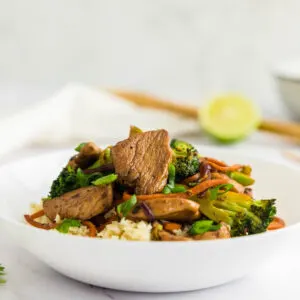 Keto chicken stir fry in a white bowl
