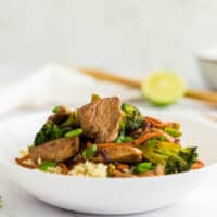 Keto chicken stir fry in a white bowl.