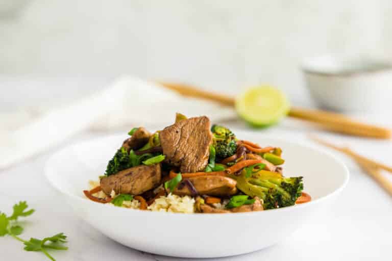 Keto chicken stir fry in a white bowl.