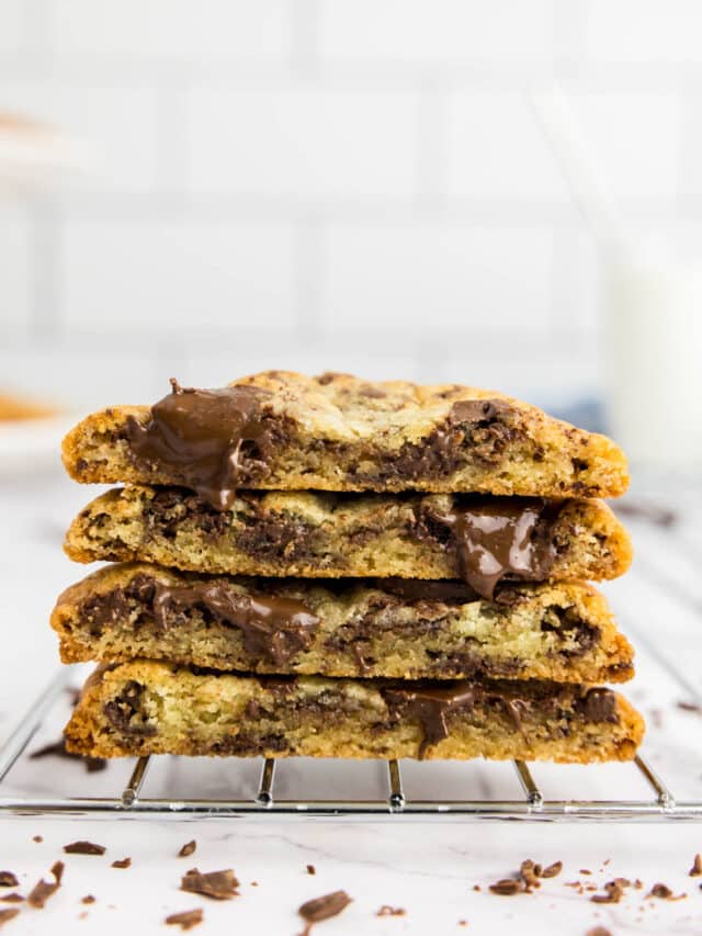 Chocolate chip cookies halved on a cooling rack