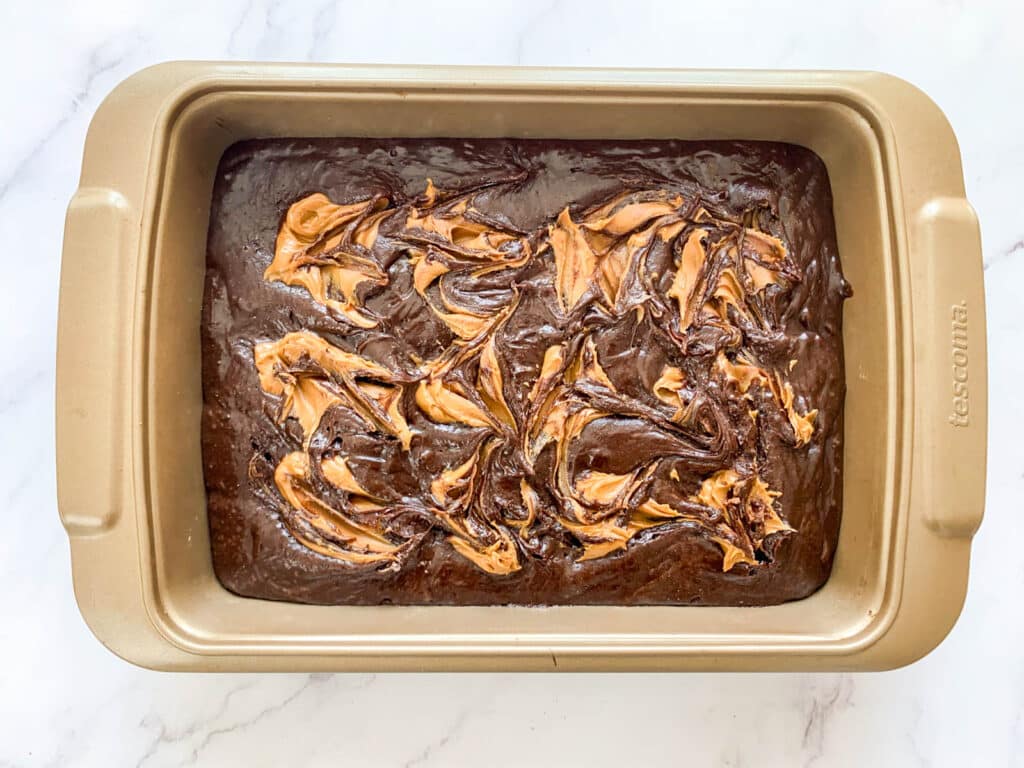 Biscoff brownie batter in a baking pan