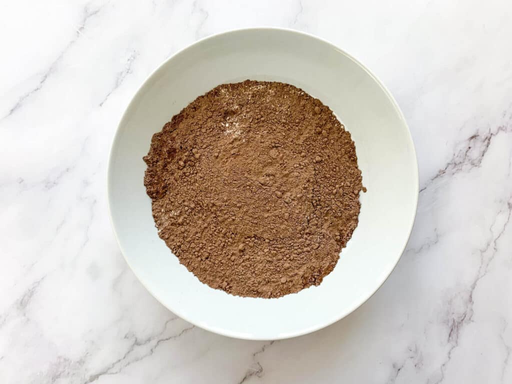 Cocoa powder, flour and salt that has been mixed together in a bowl
