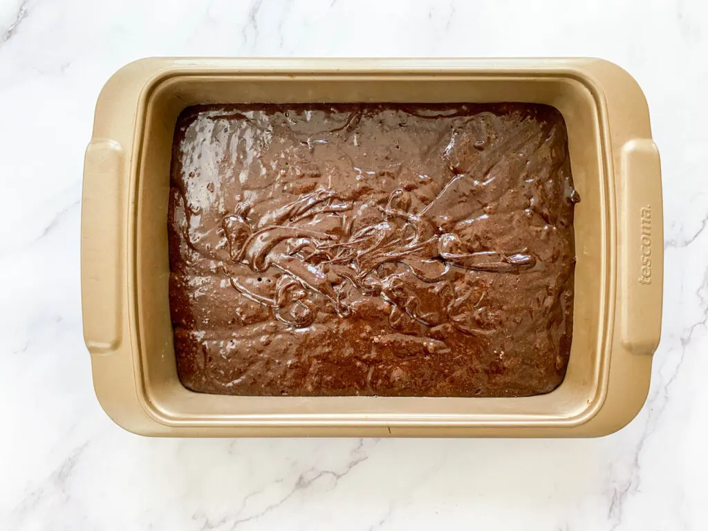 Brownie batter in a baking pan
