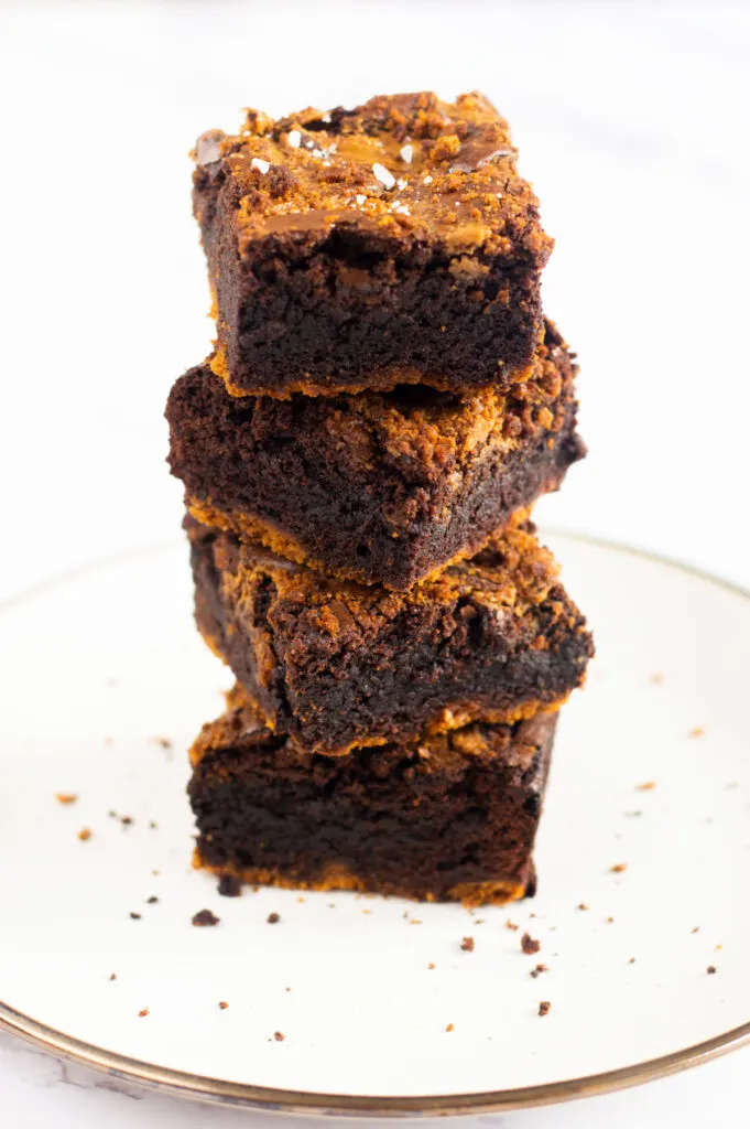 Stack of biscoff brownies on a plate