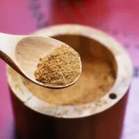 Coconut sugar in a wooden spoon