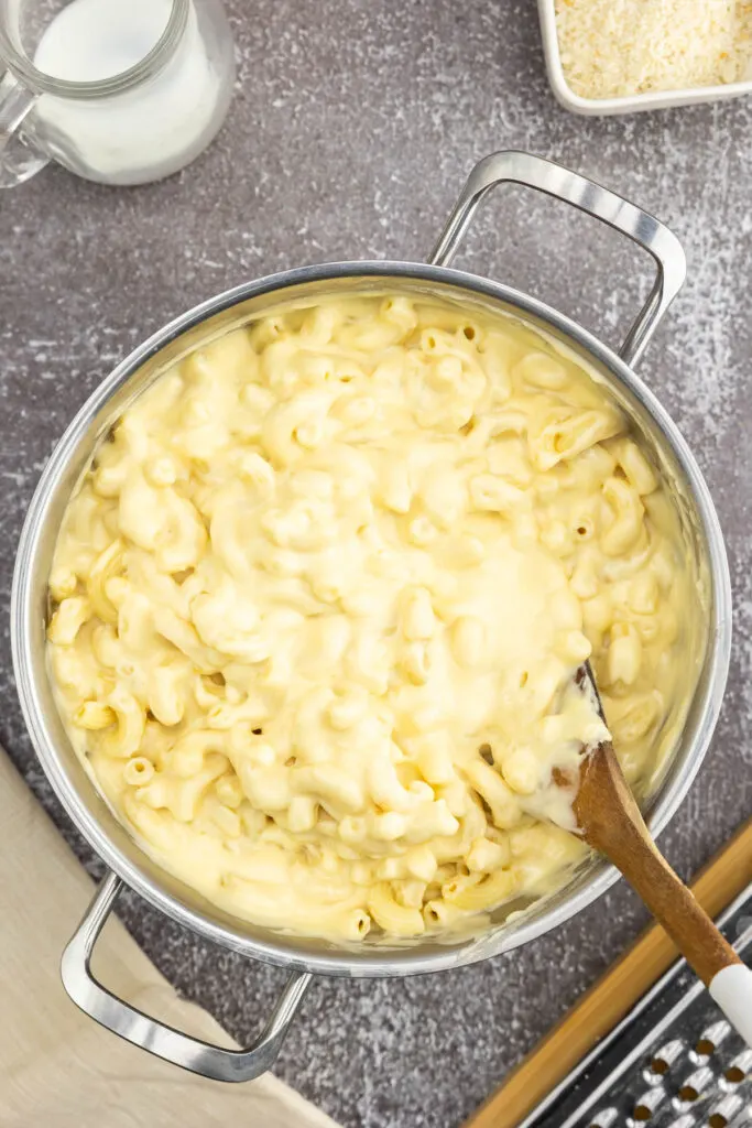 Macaroni mixed into a smoked gouda cheese sauce