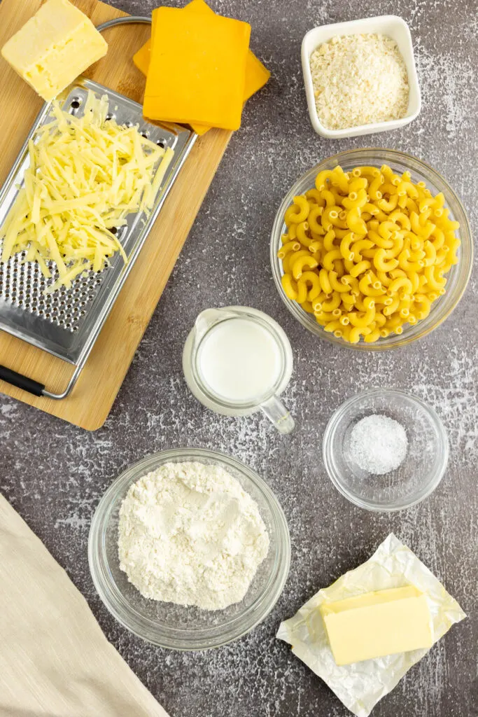 Smoked gouda, american cheddar, macaroni, milk, flour, butter, salt and bread crumbs portioned in dishes