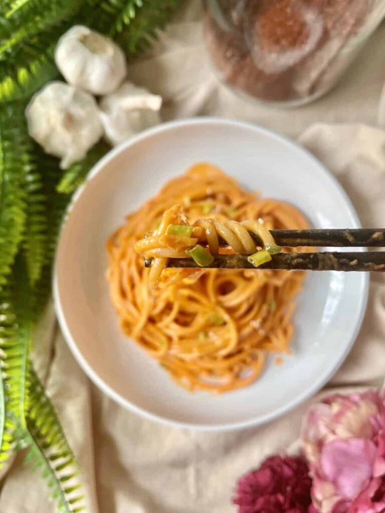 Gouchjang spaghetti being picked up by chop sticks