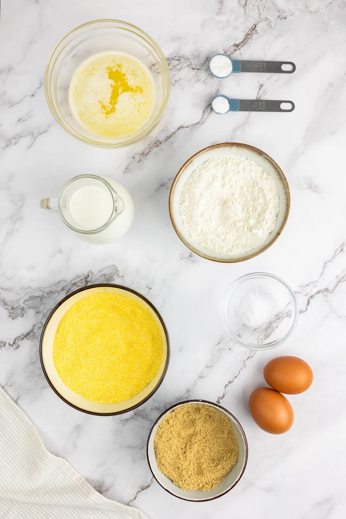 Cornbread ingredients portioned in bowls