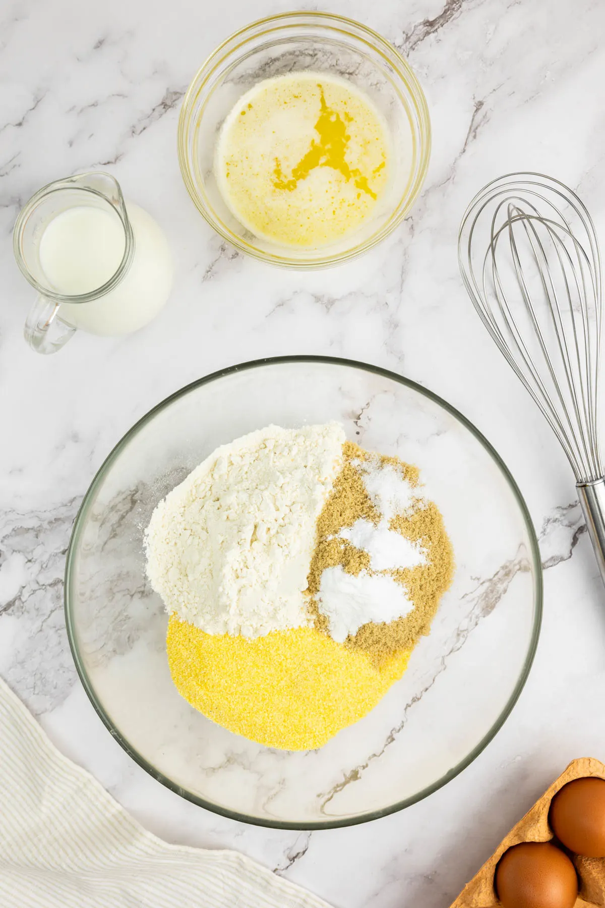 fine cornmeal, all-purpose flour, baking powder, baking soda, and salt in a large bowl