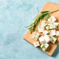 Feta cheese on a wooden board.