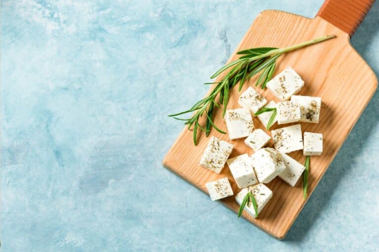 Feta cheese on a wooden board.