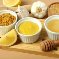 Three types of mustard and mustard seeds.