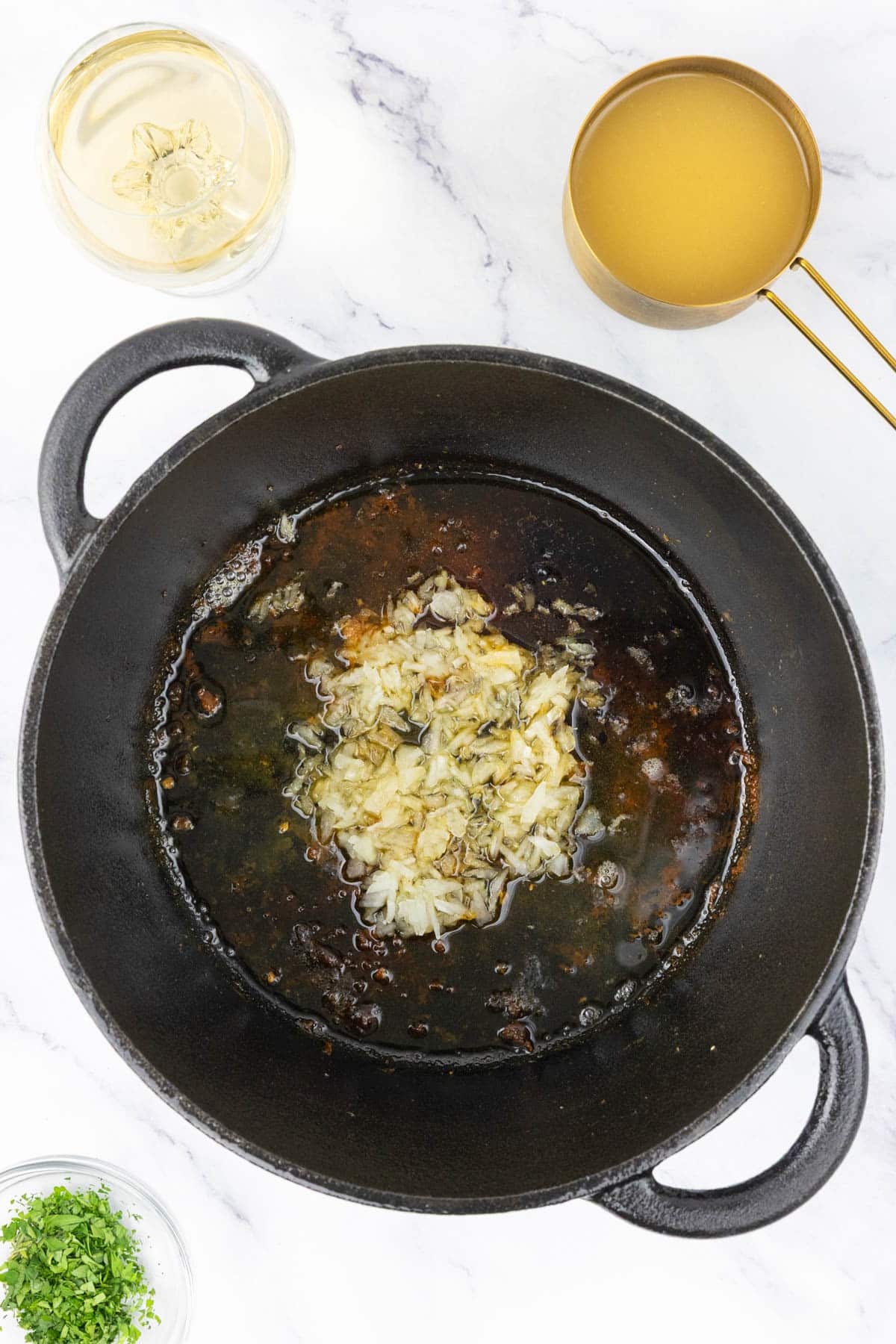 Onions cooking in a pan.