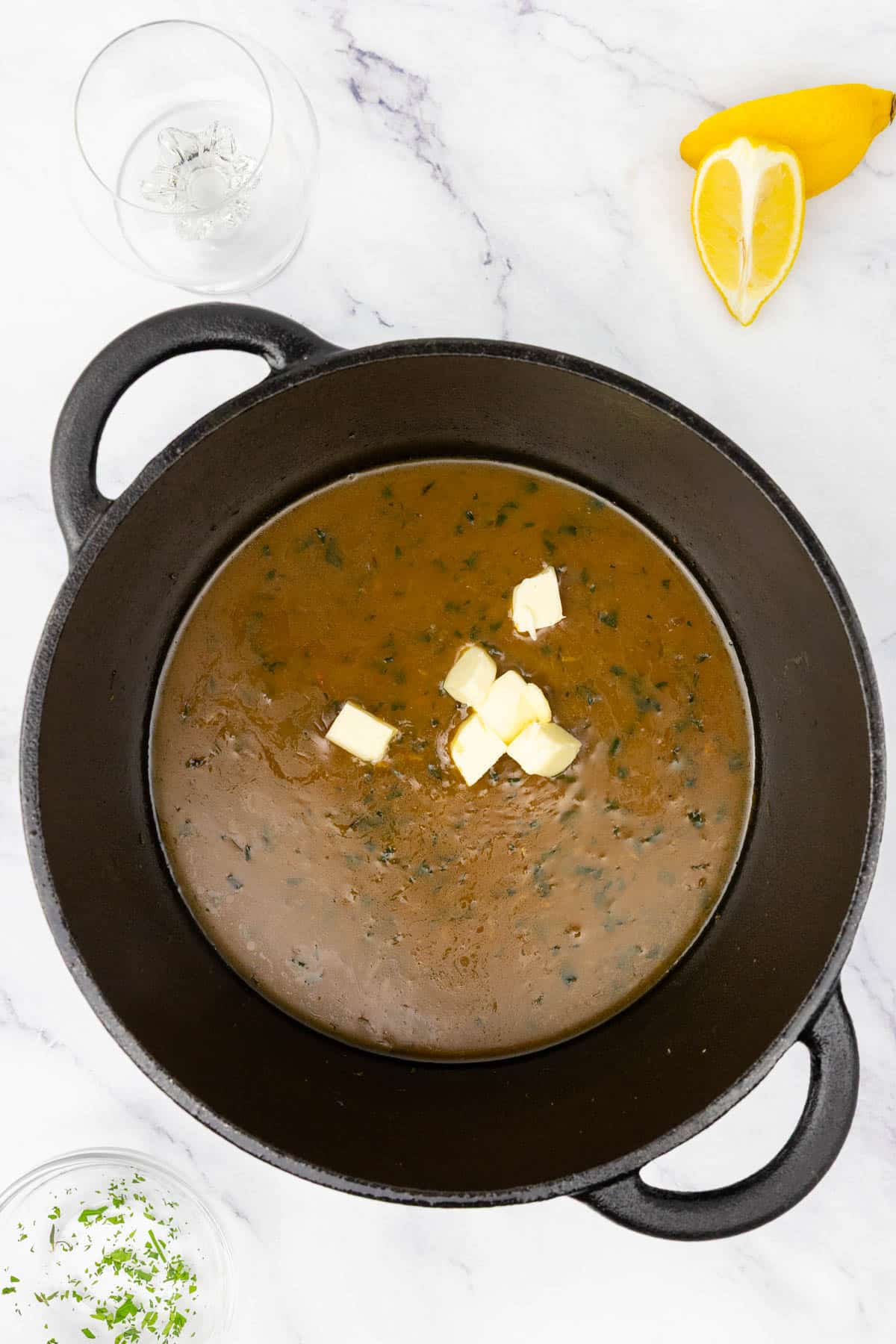 Cubed butter added to the pan sauce.