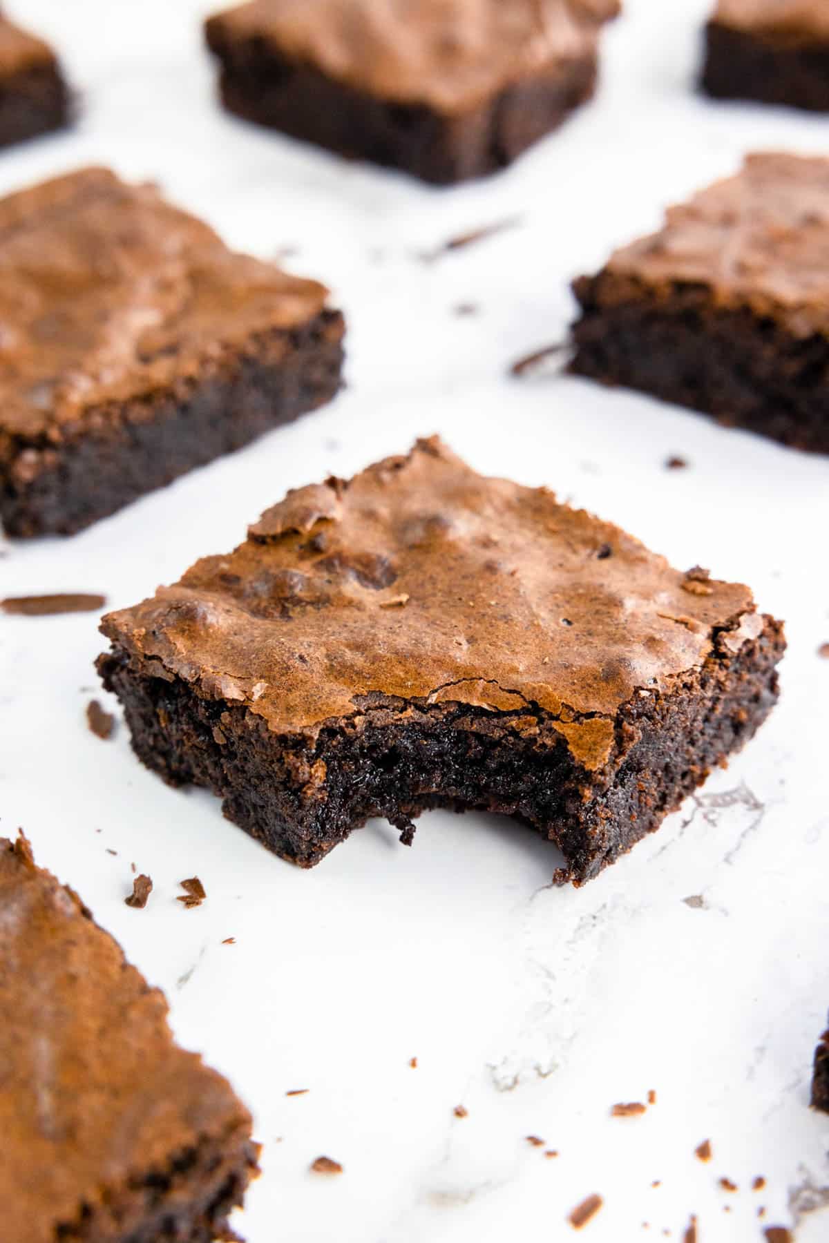 Brownie with a bite taken with a chocolatey middle.